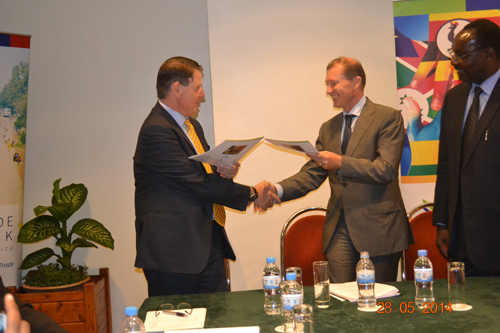 From Left to Right – TradeMark Africa CEO Frank Matsaert exchanges MOU documents with Belgian Ambassador to <a href=