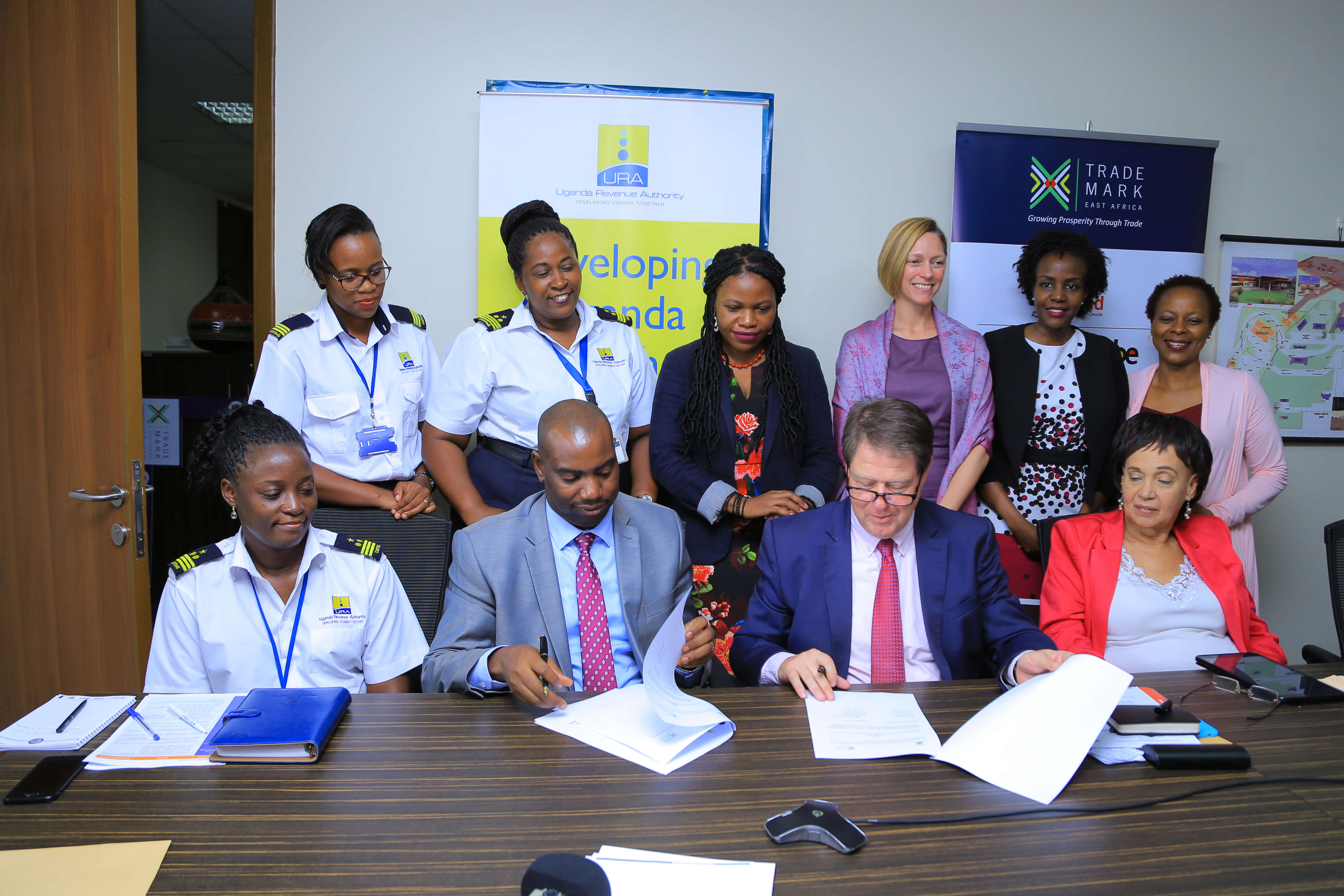 Uganda Revenue Authority and TradeMark Africa sign deal to support women traders.