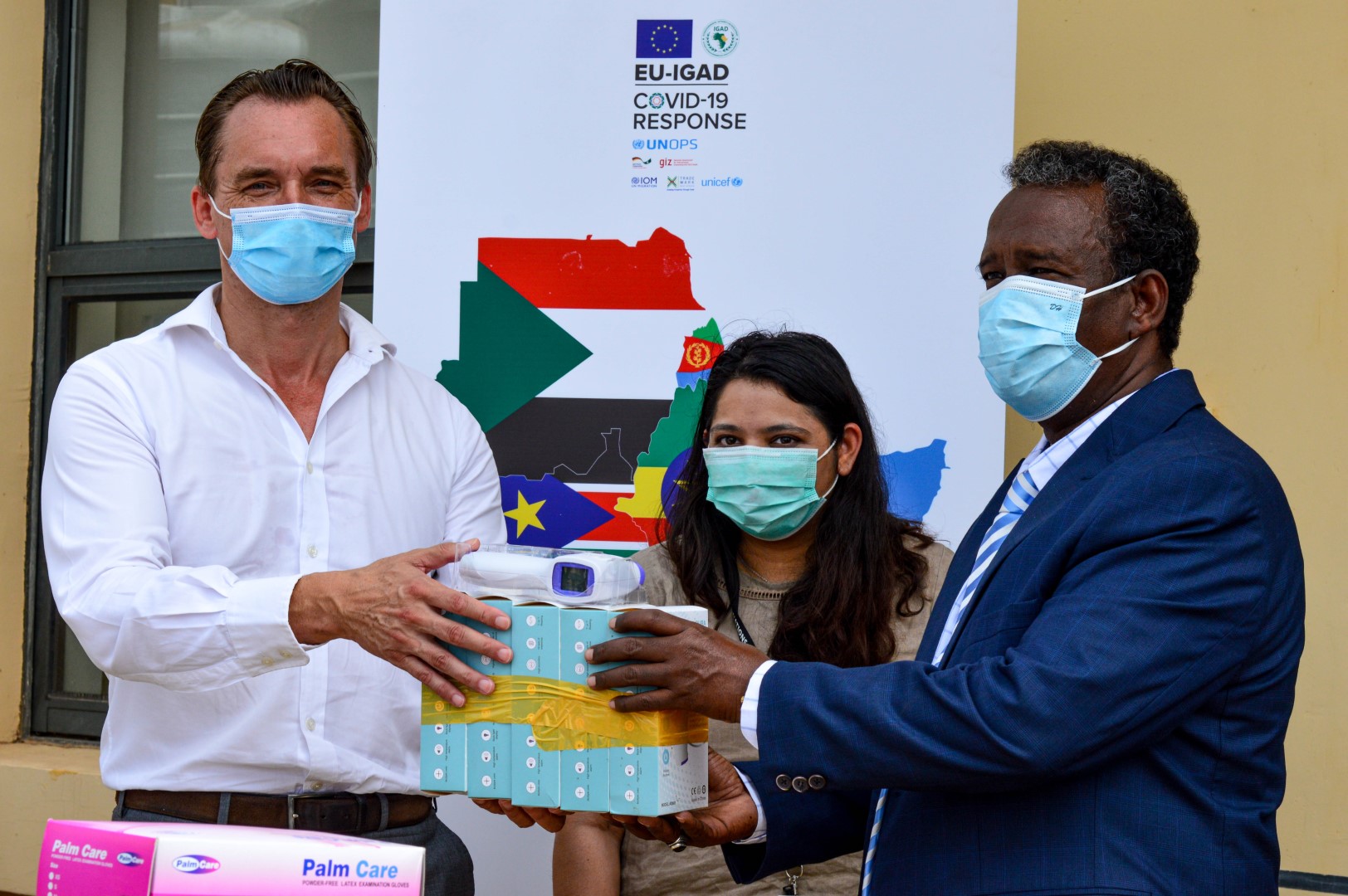 As part of the EU-IGAD Covid-19 response, regional trade facilitation agency TradeMark Africa (TMEA) has this morning handed over Personal Protective Equipment (PPE) worth US$ 106K to the Government of Djibouti to sustain momentum in the fight against the COVID-19 pandemic and protect the health and well-being of people in Djibouti. The handover was done at the Djibouti port, which is a key trade facility handling 8 million tonnes of cargo annually. The PPEs have also been delivered to border officials at the Guellileh border and will also be delivered to the Galafi border, key transit trade points with Ethiopia. Today’s PPE’s delivery will cover the needs of 1000 Ports Authority staff, Port Police, Revenue Authority staff, Port health staff and sustain them for 120 days. The 1000 staff were prioritised as they are the first responders and most vulnerable dealing with port health, first aiders and handling of cargo as it arrives. The PPE’s include hand sanitisers, liquid disinfectant, infrared thermometer, full protective coveralls, face masks, gloves and face shields. The delivery to the Port of Djibouti is critical and strategic as the port is the main entry point into the Horn of Africa serving Ethiopia, Somaliland and South Sudan. The equipment presented today will enhance the safety and working condition of front-line workers in key borders, which are critical arteries of trade in and out of Djibouti and her neighbours. Among the borders where the PPE will be distributed is Galafi. Rossella Monti, Senior Project Manager, UNOPS Programme Management Unit - EU-IGAD COVID-19 Response, noted UNOPS role in mitigating the impact of the Covid-19 pandemic in Djibouti. "Under this EU-IGAD COVID-19 Response programme, we support safe trade in Djibouti by mitigating the impact of the COVID-19 pandemic in cross-border areas and protecting the health and well-being of frontline workers in border areas." TradeMark Africa Country Director for Djibouti Sjoerd Visser underscored the need for the country to safeguard and boost her trade and economy amidst efforts to contain the Corona Pandemic “What we have learned through this crisis is that quick action to protect the people at the front line of the ensuring critical supplies still reach where they are needed most is important; that coordinated action at the regional level is possible and that the pandemic could accelerate regional integration. It has revealed the important part that trade facilitation plays in times of crisis and especially in ensuring that producers still access markets and that essential supplies like food and medicine reach consumers. This crisis has magnified the importance of trade in ordinary development.” The TMEA Country Director further revealed that the equipment donated today is part of the EU-IGAD Covid-19 Response Programme funded by the EU, managed by UNOPS and coordinated by IGAD and implemented by TMEA, IOM, GIZ, UNICEF and UNOPS. The programme seeks to ensure regional economies continue to trade in a safe way, while curbing cross-border infections.