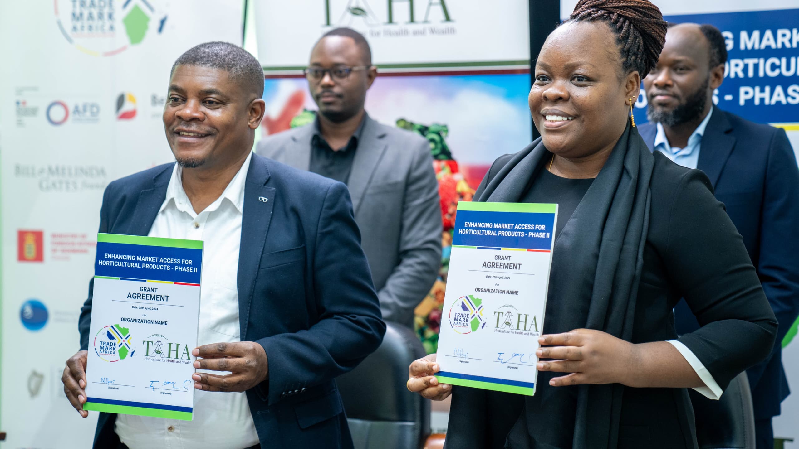 TAHA Chief Development Manager, Mr. Anthony Chamanga, and TradeMark Africa’s Regional Director for East and Central Africa, Ms. Monica Hangi